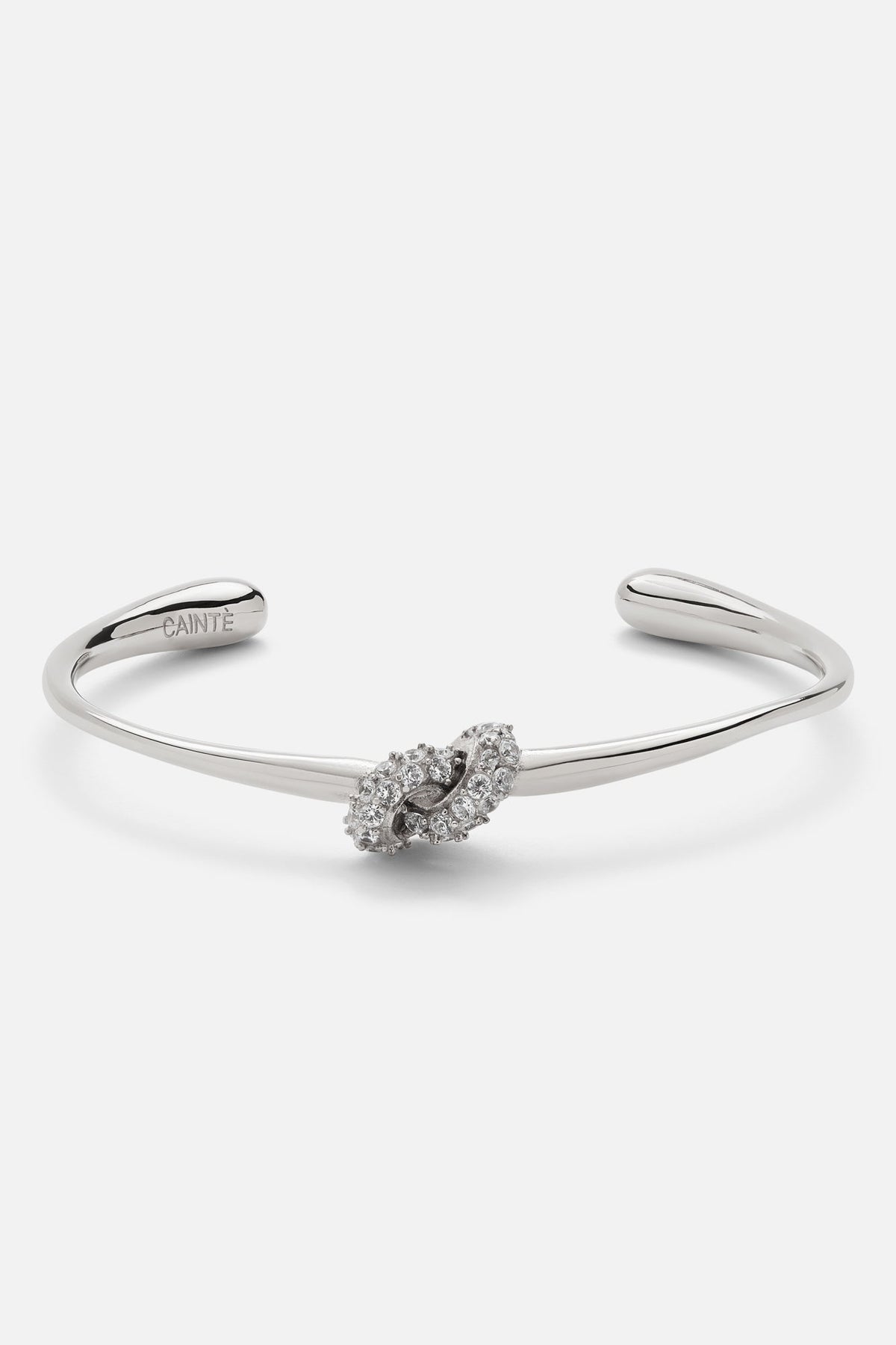 Silver-tone knot cuff bracelet, front view on a light background
