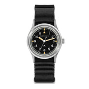 Black-dial retro military watch with cream hands on a black nylon strap