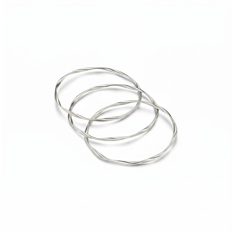 Three twisted silver-tone bangles interlinked