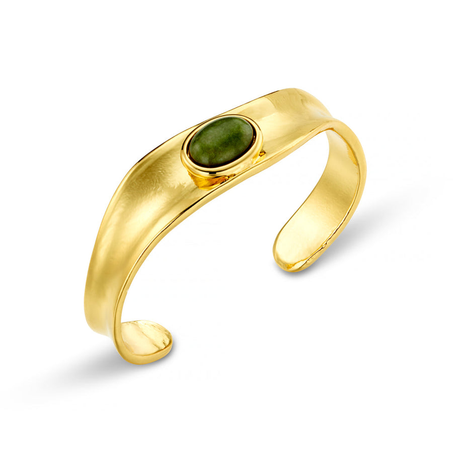 Gold-tone sculpted cuff with an oval green stone