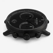 Side profile of the black case with crown flanked by two pushers.