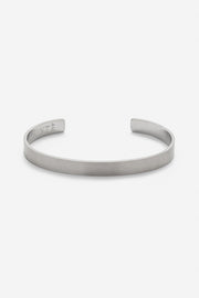 Silver-tone matte cuff bracelet, front view on a light background