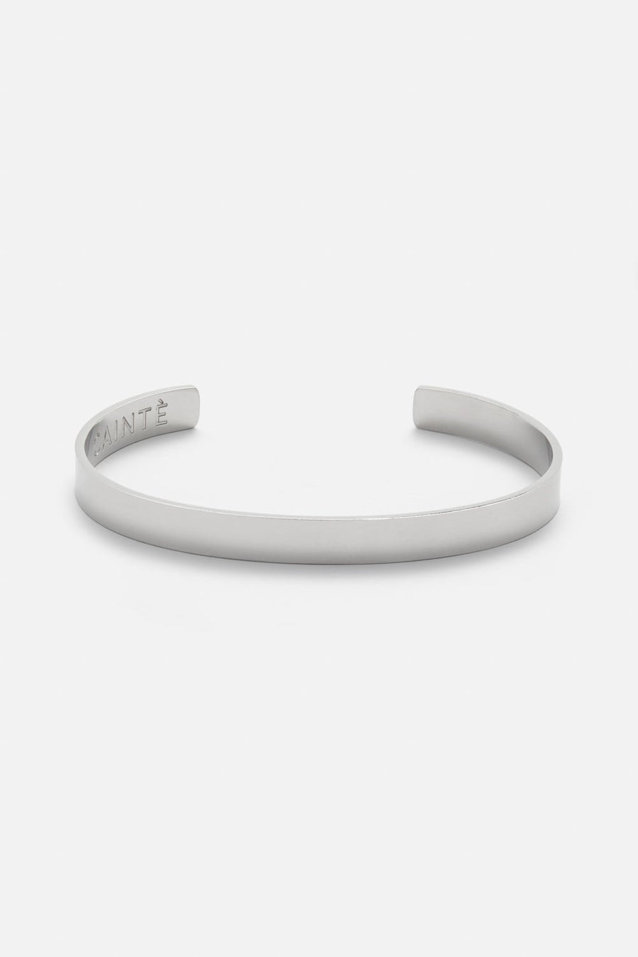 Silver-tone polished cuff bracelet, front view on a light background