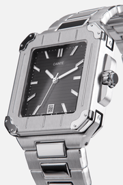 Angled view of the square case with screw details at the corners and black dial