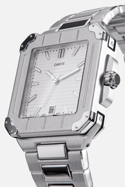 Angled view of the square case with screw details at the corners and white dial