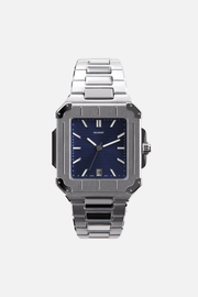 Front view of the square watch with navy blue dial on its integrated bracelet