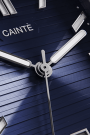 Close-up of the navy blue horizontally ridged dial and hands