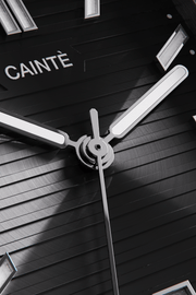 Close-up of the black horizontally ridged dial and hands
