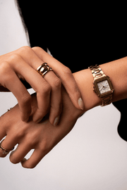 Close-up of the small square watch on a woman’s wrist