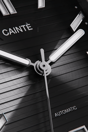 Close-up of the black horizontally ridged dial and hands