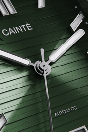 Close-up of the green horizontally ridged dial and hands