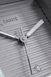 Close-up of the gray ridged dial with its single clear stone