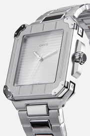 Angled view of the square case with screw details at the corners and silver dial