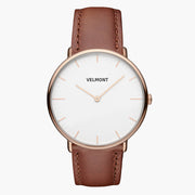 White-dial watch with a rose gold-tone case and brown strap, facing forward.