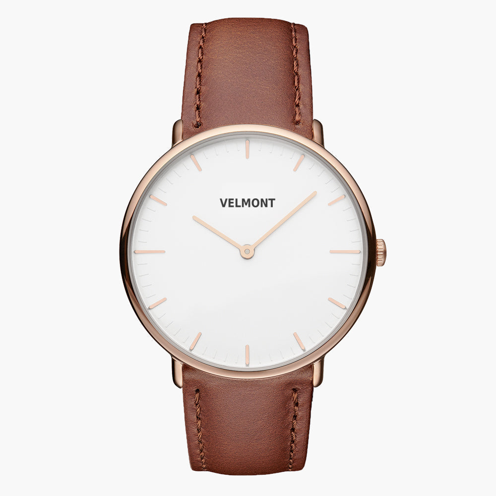 White-dial watch with a rose gold-tone case and brown strap, facing forward.