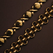 Close-up of gold-tone links on dark fabric