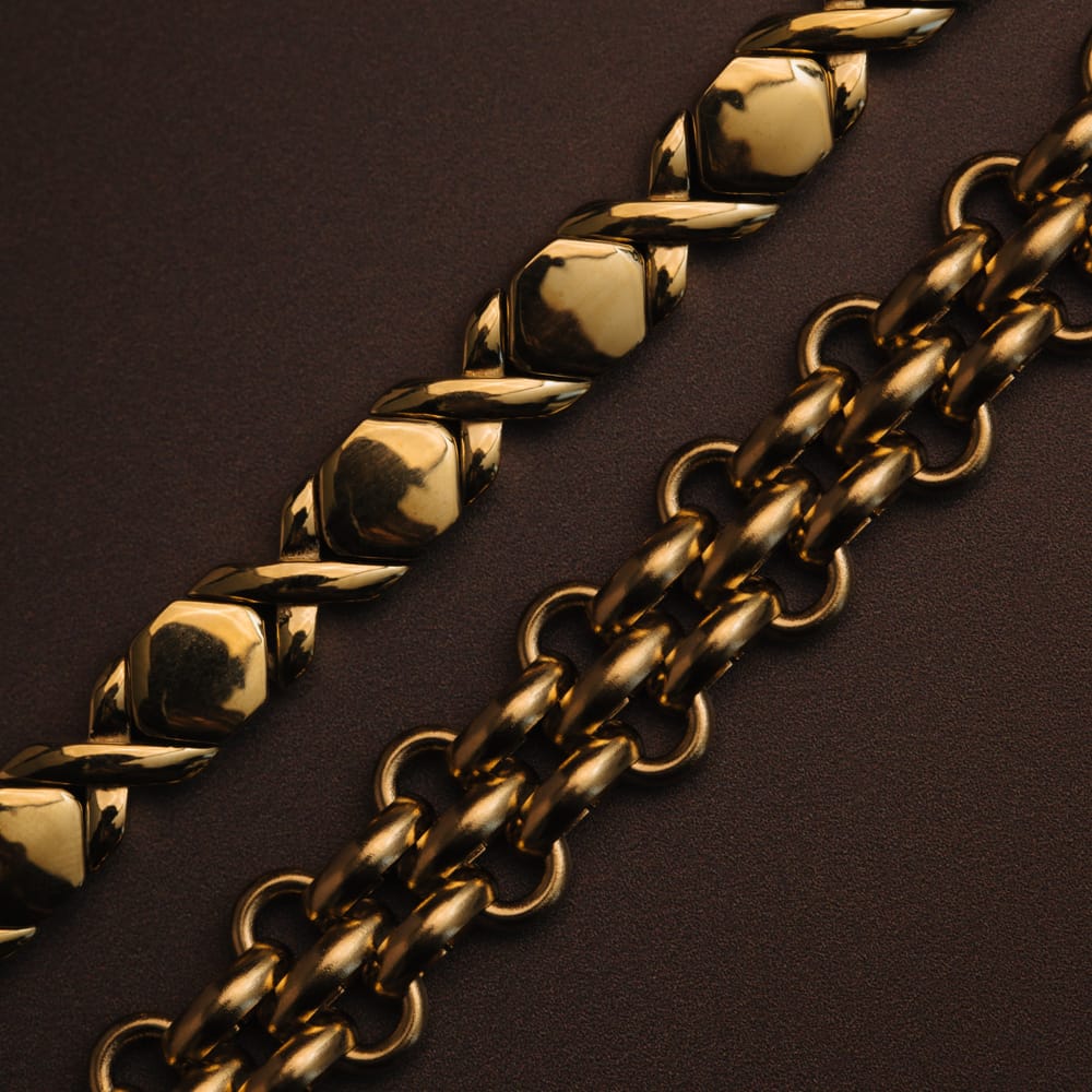 Close-up of gold-tone links on dark fabric