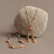 Pink stone bracelet shown with a matching necklace and earrings