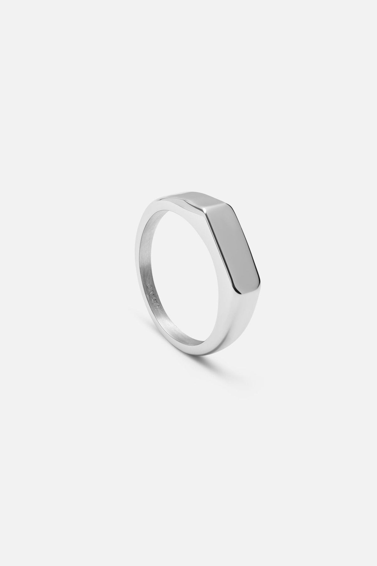 Signet ring at an angle showing the flat rectangular top