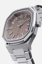 Three-quarter view of the octagonal case and mocha textured dial