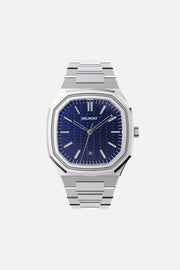Front view of the octagonal watch with blue textured dial on its integrated bracelet