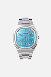 Front view of the octagonal watch with turquoise textured dial on its integrated bracelet