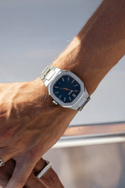 Close-up of the watch on a wrist aboard a boat