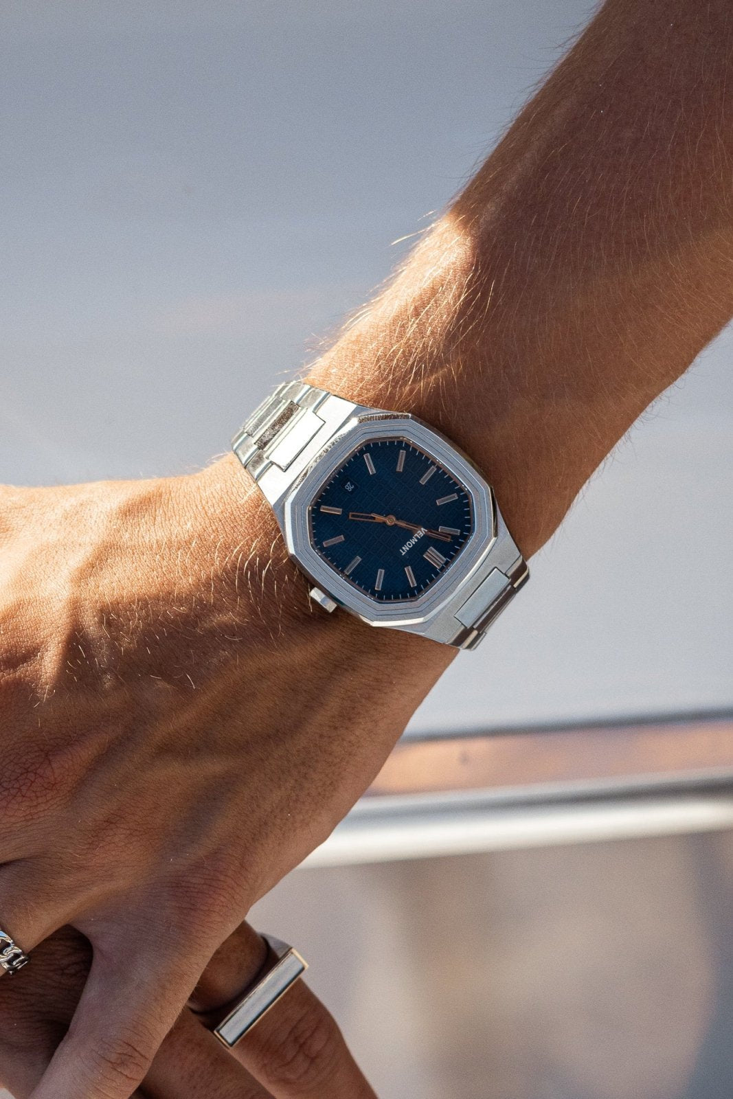 Close-up of the watch on a wrist aboard a boat