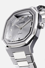 Three-quarter view of the octagonal case and silver Arabic numeral dial