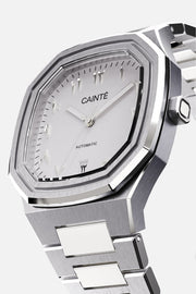Three-quarter view of the octagonal case and white Arabic numeral dial