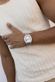 Hand on the chest with the watch on the wrist