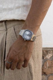 Wrist by linen trousers wearing the watch