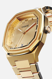 Three-quarter view of the octagonal case and gold-tone Arabic numeral dial