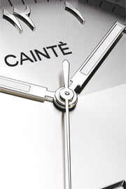 Macro view of the silver Arabic numeral dial and polished hands