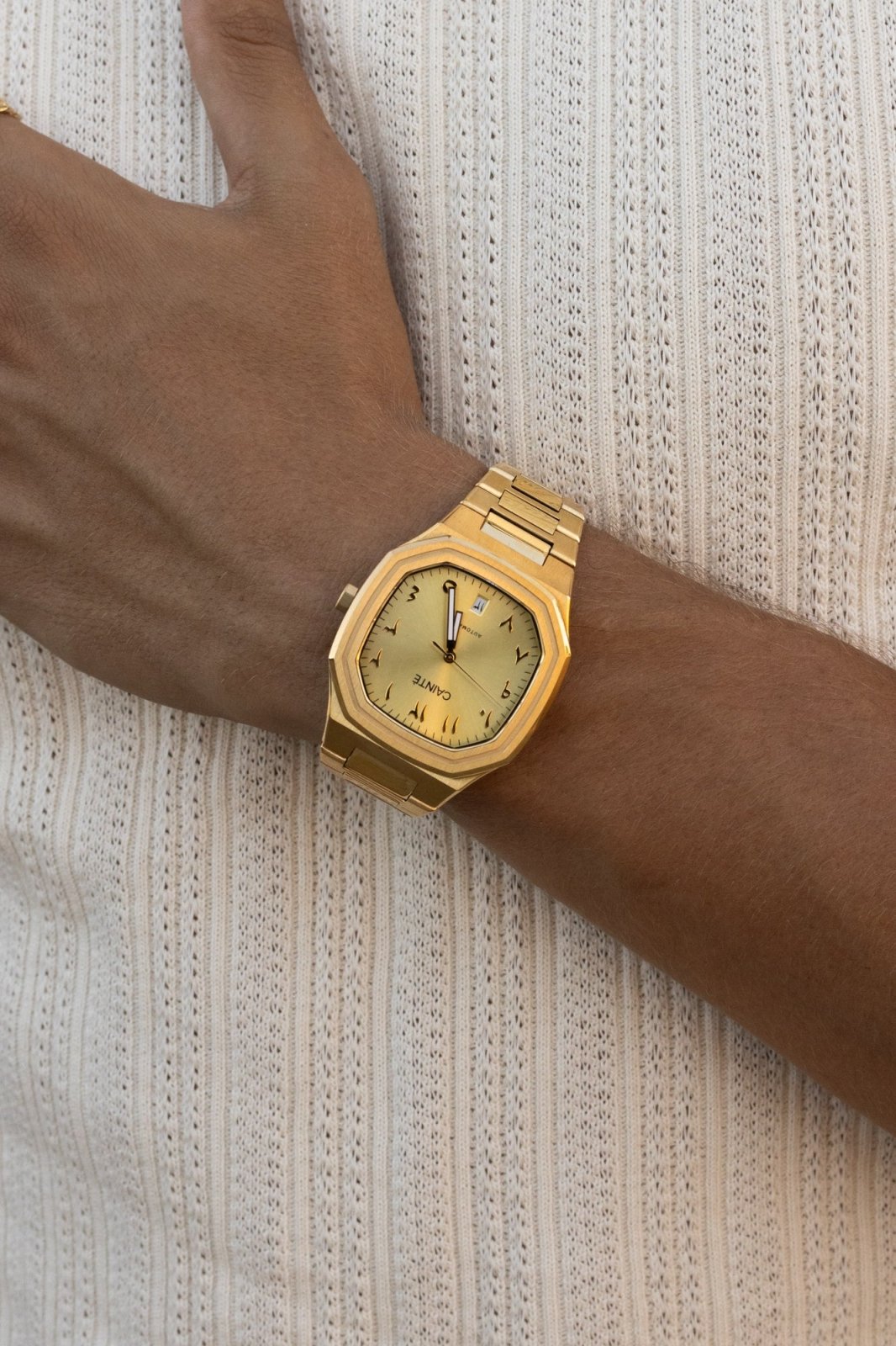 Arm across a ribbed top with the watch on