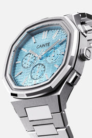 Three-quarter view of the octagonal case and turquoise chronograph dial