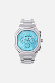 Front view of the octagonal watch with turquoise chronograph dial on its integrated bracelet