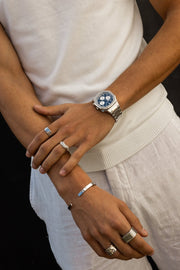 Close view of crossed arms with the watch