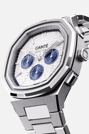 Three-quarter view of the octagonal case and white day-date dial