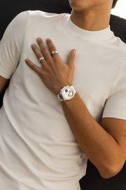 Hand on the chest wearing the watch