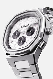 Three-quarter view of the octagonal case and white chronograph dial