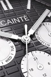Macro view of the black day-date dial and polished hands