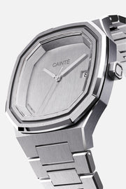 Three-quarter view of the octagonal case and monochrome silver dial