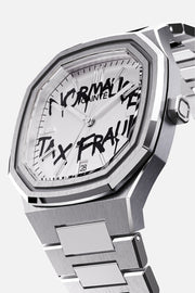 Three-quarter view of the octagonal case and white dial with black graffiti lettering
