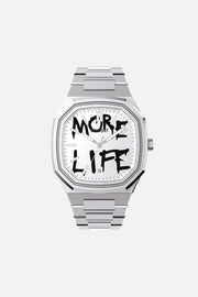 Front view of the octagonal watch with white dial with black graffiti lettering on its integrated bracelet