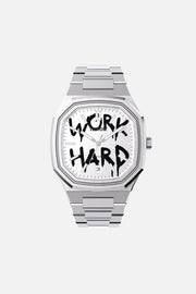 Front view of the octagonal watch with white dial with black graffiti lettering on its integrated bracelet