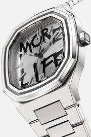 Angled close view of the case and white dial with black graffiti lettering