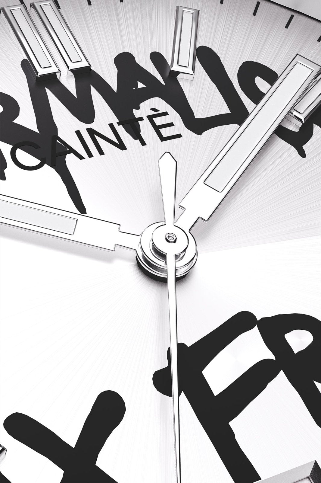 Macro view of the white dial with black graffiti lettering and polished hands