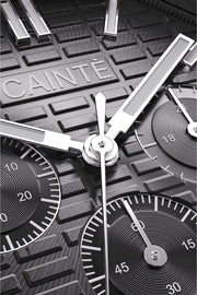 Macro view of the black chronograph dial and polished hands