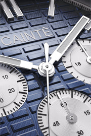 Macro view of the blue chronograph dial and polished hands